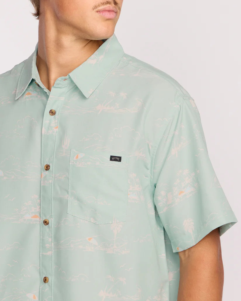 Light green short-sleeve shirt with subtle pattern on a plain background