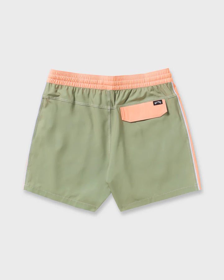 Green shorts with pink waistband and side stripe on a light gray background