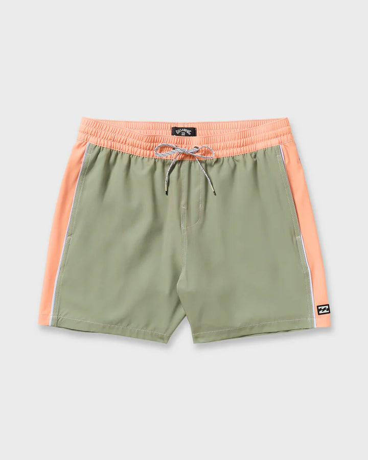 Green shorts with pink waistband and side panels on a light gray background 6